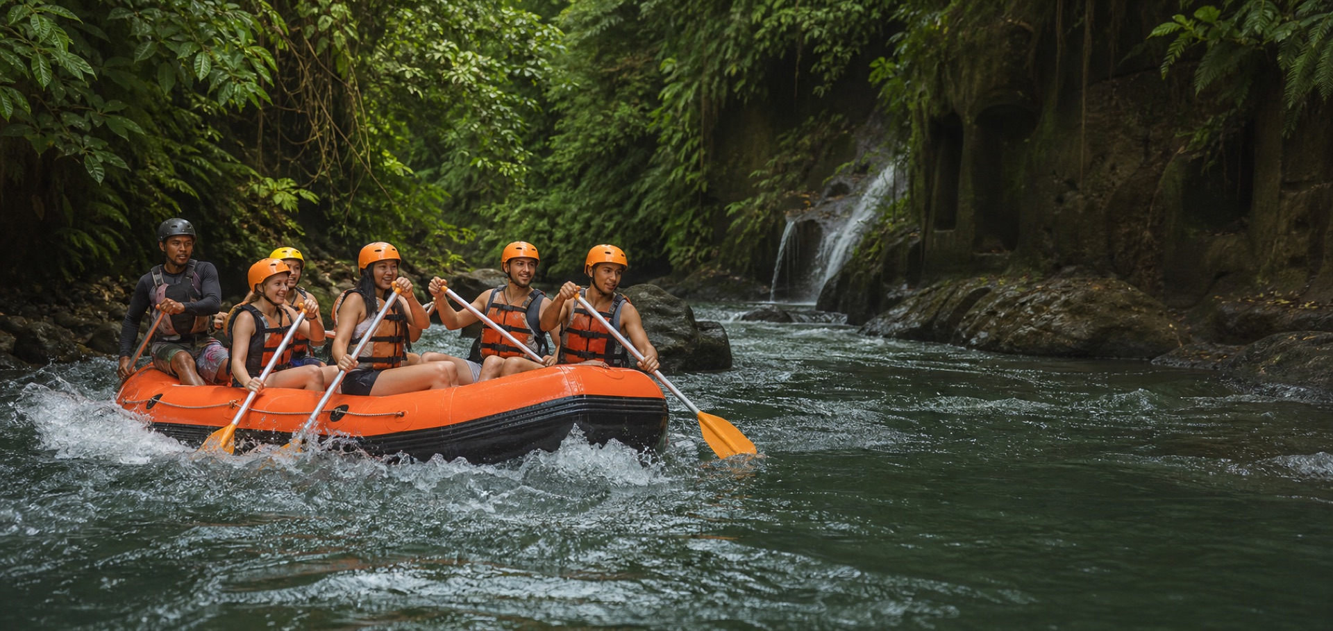 A guided rafting group paddling through a green Ubud river canyon